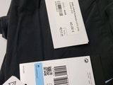 two tags on the back of a pair of pants