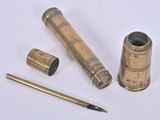 a small telescope and a pen on a white surface