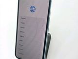 a cell phone that is sitting on top of a stand