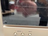 someone is taking a picture of a microwave with their reflection in the oven
