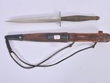 two different types of knives on a white surface