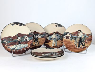 three plates with a picture of a man on a horse and a man on a horse