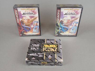 two video games are sitting next to each other on a table