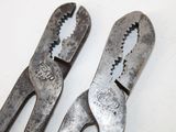 two pliers that are sitting next to each other on a table