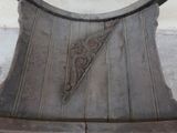 a wooden bench with a decorative design on it
