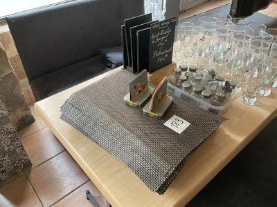 a table with a lot of wine glasses on it
