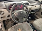 a dashboard of a small car with a clock on it