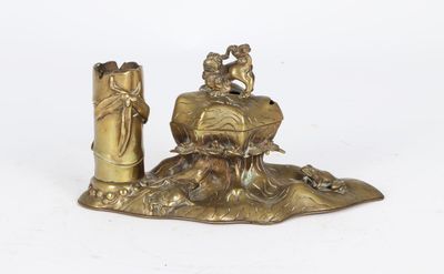 a gold statue of a man and a woman on a rock