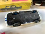 a toy car that is sitting on a table next to a box