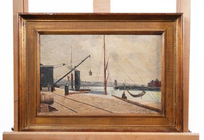 a picture of a painting on a easel with a boat in the background