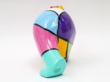 brightly colored elephant figurine on a white surface with a white background