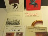four books are sitting on a table next to each other