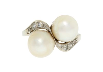 an image of a white pearl and diamond ring on a white background