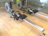 two stationary exercise bikes in a gym room
