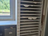 a room that has a bunch of shelves in it