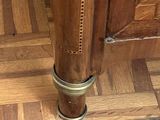 a close up of a wooden floor with a wooden door in the background