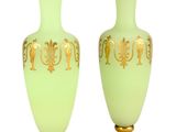 pair of green and gold vases on a white background