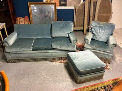 a couch, chair, ottoman, and ottoman in a room
