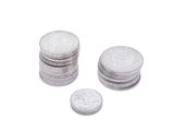 a lot of coins sitting on top of each other on a white surface