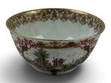 a bowl that has a picture of a woman in a garden on it