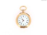 a gold pocket watch with roman numerals on the face