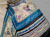 a dress on a mannequin with a blue and white design on it