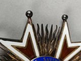 a star shaped brooch with a star on it