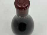 a bottle of wine that is sitting on a table