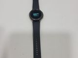 a close up of a smart watch sitting on a table