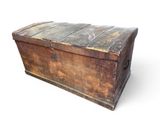 an old wooden chest with a metal latch on the top