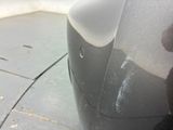 a close up of a car ' s bumper with a hole in it