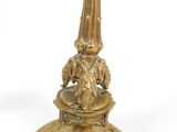 a gold table with a clock on top of it