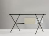 a white desk with a glass top and metal legs