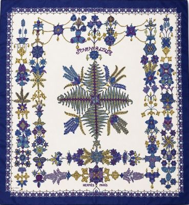 a blue and white table cloth with a floral design on it