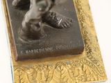a statue of a man holding a baseball bat on a plaque