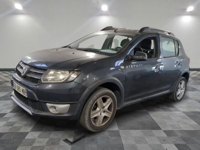 a picture of a grey car parked in a garage