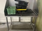 an image of a kitchen area with a sink and a table