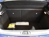 the trunk of a blue car with a box in the trunk