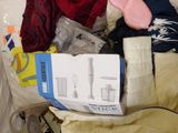 a pile of clothes that is sitting on the floor