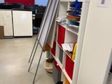 a room that has a bunch of books on the floor