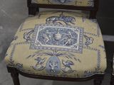 two chairs that have blue and white designs on them