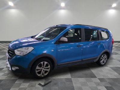 the blue car is parked in a large room with a checkered floor