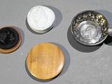 three bowls and a wooden spoon on the table