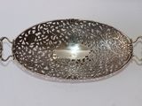 a silver plate with a handle and a handle on it