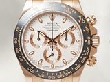 rolex watch with rose gold bezel and black rubber strap