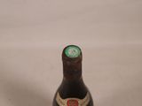 a bottle of beer that is sitting on a table