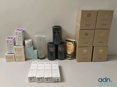 many boxes of skin care products sitting on a table