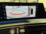 a picture of a car ' s rear view mirror with a camera attached to it