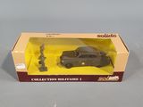 a box with a toy car in it sitting on a table