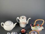 several different types of teapots and tea pots on a table
